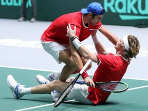 Andrey Rublev of Russia and teammate Karen Khachanov celebrate winning match point in their quarter-final doubles match against Serbia on Day Five of the 2019 Davis Cup at La Caja Magica on Friday, Nov. 22, 2019 in Madrid.