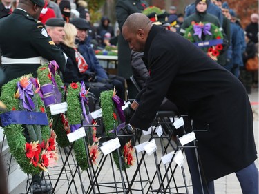 Councillor Rawlson King lays a wreath on behalf of the City of Ottawa during the Remembrance Day Ceremony at the National Military Cemetery, November 11, 2019.