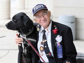 Royce Alan Van Every, 61, and his support dog leave Ontario Court of Justice Thursday.