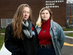 Grade 11 students Maizie Schwets, 16, , left and Diane Hatheway, 15, say the current dress code's ban on 'revealing' clothing seems aimed at girls.