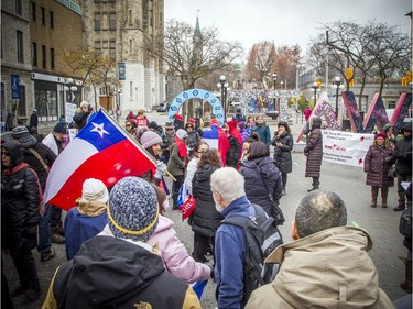 A small group gathered to show support to Chilean family and friends Saturday November 9, 2019, at the Ottawa sign downtown before marching to Parliament Hill.