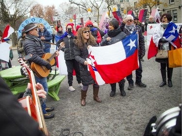 A small group gathered to show support to Chilean family and friends Saturday November 9, 2019, at the Ottawa sign downtown before marching to Parliament Hill.