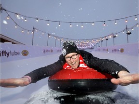 Geordie MacLeod, Grey Cup festival executive director, hams it up on the Jiffy Lube Tube Slide during a media event on Tuesday.
