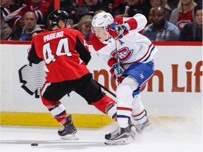 Brendan Gallagher of the Canadiens chips the puck past Jean-Gabriel Pageau of the Senators during an October 2017 game in Ottawa.