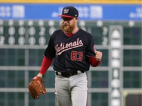 Oct 29, 2019; Houston, TX, USA; Washington Nationals pitcher Sean Doolittle (63) celebrates after defeating the Houston Astros in game six of the 2019 World Series at Minute Maid Park.