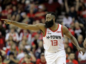 Houston Rockets guard James Harden celebrates after a made three-point shot against the Atlanta Hawks during the third quarter at the Toyota Center.