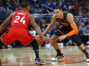 Orlando Magic forward Aaron Gordon drives to the basket against Toronto Raptors guard Norman Powell during the second half at Amway Center.