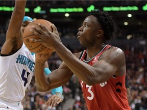 Raptors forward O.G. Anunoby prepares to shoot the ball against Hornets guard Devonte Graham in the second half of Monday's NBA game in Toronto.