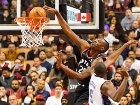 Raptors forward Chris Boucher (25) dunks the ball against Magic centre Mo Bamba (5) during NBA action at Scotiabank Arena in Toronto, on Wednesday, Nov. 20, 2019.