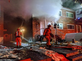 Firefighters at a home on Morin Street.