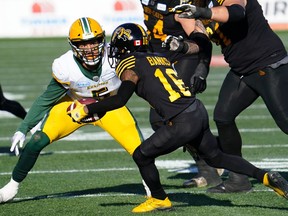 Hamilton Tiger-Cats wide receiver Brandon Banks 
 carries the ball as Edmonton Eskimos   Jovan Santos-Knox defends during the CFL Eastern Conference Final football game at Tim Hortons Field on Sunday.