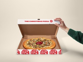 Boston Pizza's Christmas Pizza is delivered in a limited edition musical box.