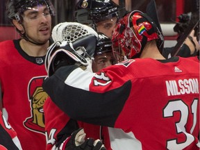 ttawa Senators center Jean-Gabriel Pageau (44) celebrates with goalie Anders Nilsson (31) after defeating the Los Angeles Kings in overtime at the Canadian Tire Centre.