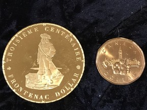 A solid gold municipal token minted in honour of Kingston's 300th birthday alongside a loonie. Only three gold tokens were minted, and two of them were presented to the Queen and Prince Philip during their royal visit in 1973. (Supplied Photo)