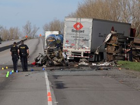 Ontario Provincial Police investigate the crash on Highway 401 west of Joyceville Road on May 11, 2017, that left four dead and two in hospital. (Ian MacAlpine/The Whig-Standard)