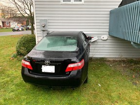 OPP photo of car going into a house on Russell County Ontario.