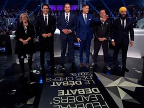 Federal party leaders, Green Party leader Elizabeth May, Liberal leader Justin Trudeau, Conservative leader Andrew Scheer, People's Party of Canada leader Maxime Bernier, Bloc Quebecois leader Yves-Francois Blanchet and NDP leader Jagmeet Singh, pose for a photograph before the Federal leaders debate in Gatineau, Quebec, Canada Oct. 7, 2019.