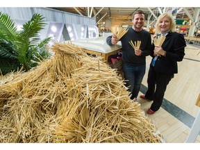 Marion Town of the Vancouver International Airport Authority, and Felix Böck, CEO and founder of ChopValue, at a pop-up installation commemorating the airport's collection and recycling of its first million disposable chopsticks.