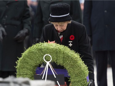 Silver Cross Mother Reine Samson Dawe lays a wreath as she participates in the Remembrance day ceremony at the National War Memorial Monday November 11, 2019 in Ottawa.