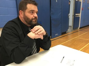 Parent Scott Chamberlain at a meeting with parents and school board officials to discuss repairs at Alta Vista Public School on Wednesday night.