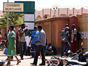 Relatives of victims of an attack on a road leading to the Boungou mine, operated by Canadian gold miner Semafo, wait outside a morgue in Ouagadougou, Burkina Faso November 8, 2019.