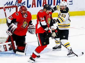 The Ottawa Senators' Mark Borowiecki blocks a shot as the Boston Bruins' Brad Marsh looks for a rebound in front of goaltender Anders Nilsson during NHL action at the Canadian Tire Centre on Wednesday  November 27, 2019. Errol McGihon/Postmedia