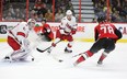 Senators’ Filip Chlapik (right) scores on Hurricanes goaltender James Reimer during the first period on Saturday night at Canadian Tire Centre.
