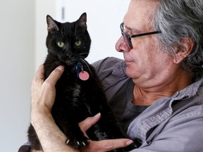 Danny Taurozzi with "Spot", one of the last surviving cats from what had been the Parliament Hill sanctuary.