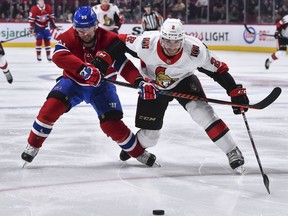 Dylan DeMelo battles against the Canadiens' Tomas Tatar on Wednesday in Montreal.