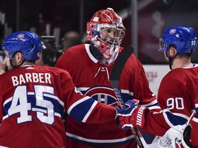 Goaltender Cayden Primeau of the Montreal Canadiens celebrates his first career NHL victory with teammates against the Ottawa Senators at the Bell Centre on Dec. 11, 2019 in Montreal.