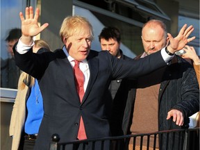 Prime Minister Boris Johnson gestures during a visit to meet newly elected Conservative party MP for Sedgefield, Paul Howell at Sedgefield Cricket Club on December 14, 2019 in County Durham, England.