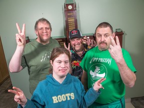 (clockwise from lower left) Suzanne Winter-Heartson, 32, Brian Jones, 48, Scott Helman, 50, and Paul Pringle, 45, are four of 33 workers with developmental disabilities that have been told their contract shredding paper for the federal government will end next year.