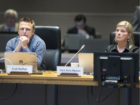 Councillors Scott Moffatt and Carol Anne Meehan during an Ottawa city council meeting.