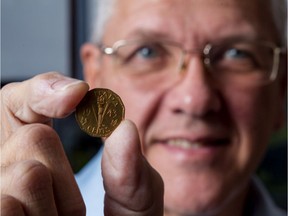 Steve Woodland, president of the Ottawa Numismatic Society holds a 1943 (Tombac) Canadian 5 cent coin.  Because of the World War, the five cents was made with a brass alloy called "tombac" to conserve nickel. December 2, 2019.