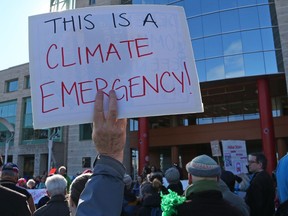 Ottawa residents rallied outside Ottawa City Hall to demonstrate support for a motion to declare a climate emergency, April 16, 2019.