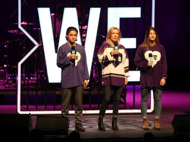 Ryan Dagenais (L), Stephanie Richardson and Kathryn Stockdale (R), Do it for Daron Foundation speak at the We Day festivities held at the National Arts Centre in Ottawa, December 10, 2019.
