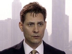 In this file image made from a video taken on March 28, 2018, Michael Kovrig, an adviser with the International Crisis Group, a Brussels-based non-governmental organization, speaks during an interview in Hong Kong.