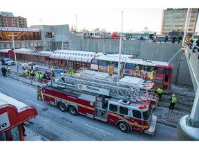 First responders attend to victims of a horrific rush hour bus crash at the Westboro Station near Tunney's Pasture.