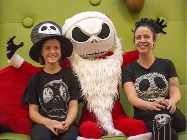 Fans, like Juliette Legault, 10, and her mom Gen Legault, of the movie "The Nightmare Before Christmas", featuring the character Jack Skellington, lined up for over two hours at Carlingwood Shopping Centre to have a picture or two taken with the Tim Burton character. The marketing manager at Carlingwood Nathalie Lavergne came up with the idea to help raise funds for the food bank while drawing customers to the mall on what is normally a slow day of the week. It's been a huge success so far.   Photo by Wayne Cuddington / Postmedia