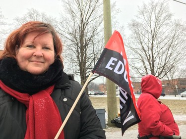 Kim Thompson, an early childhood educator at an elementary school, on the picket line Wednesday during one-day strike.