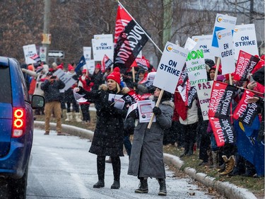 Teachers and education workers on the picket line at Ridgemont High School. Classes are cancelled for about 116,000 elementary and secondary students in Ottawa Wednesday as high school teachers and education support staff stage a one-day strike.