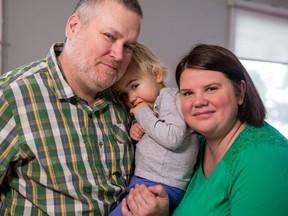 Jeff and Julie Jewett with their daughter, Lily, who has a rare condition called diencephalic syndrome, caused by a brain tumour behind her eyes.