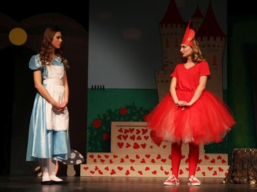 Sophie Holcik performs as Alice (L) and Vanessa Czorny performs as The Red Queen (R) during St. Pius X High School's Cappies production of Alice's Adventures in Wonderland, on December 5, 2019, in Ottawa, Ont.
