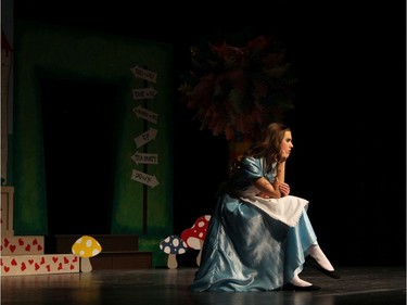 Sophie Holcik performs as Alice during St Pius X High School's Cappies production of Alice's Adventures in Wonderland on December 5, 2019.