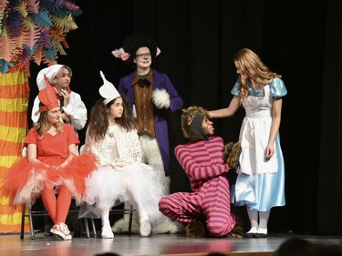 Cook played by MJ Folres-Lyons (RL), White Rabbit played by Elliott Richard (RR), Red Queen played by Vanessa Czorny (FL), White Queen played by Mallory Quinn (2ndFL), Cheshire Cat played by Abraham Nkazzonnyi (2ndFR), and Alice played by Sophie Holcik, during St Pius X High School's Cappies production of Alice's Adventures in Wonderland, held on December 5, 2019.