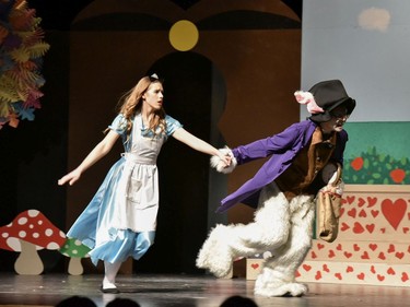 Alice played by Sophie Holcik (L), and White Rabbit played by Elliott Richard (R), during St. Pius X High School's Cappies production of Alice's Adventures in Wonderland, held on December 5, 2019.
