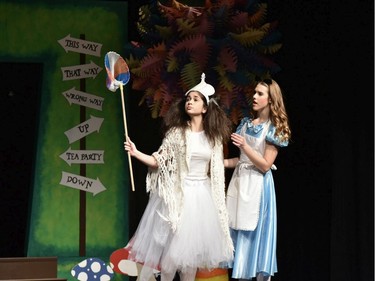 White Queen played by Mallory Quinn (L), and Alice played by Sophie Holcik (R), during St. Pius X High School's Cappies production of Alice's Adventures in Wonderland, held on December 5, 2019.