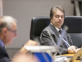 Councillor Rick Chiarelli (R) looks at his fellow councillors as Ottawa city council debates thee 2020 Budget.
