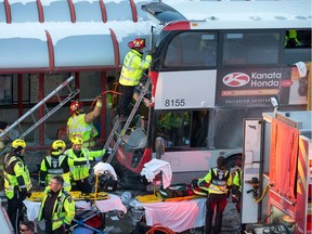 First responders attend to victims of a horrific rush hour bus crash at the Westboro Station near Tunney's Pasture Jan. 11, 2019