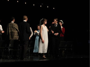 Emily Webb played by Greer Truelove (L) and George Gibbs played by Carlos Sanchez (R) perform during St. Mark High School's Cappies production of Our Town on December 14, 2019.